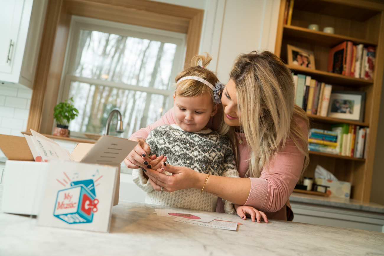 baby and woman playing with my musicbox