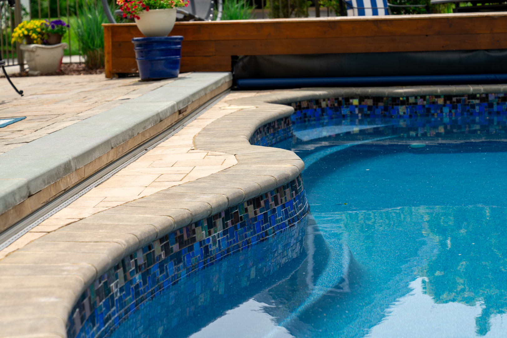 A pool edge demonstrating Windridge's hardscaping work.