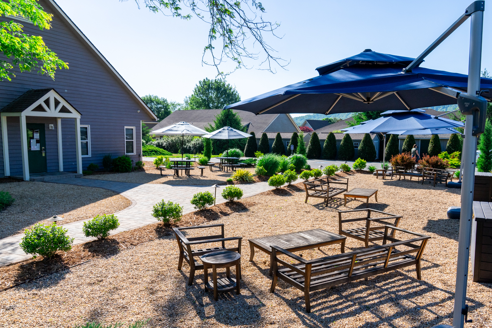 Outdoor patio area with custom landscaping and seating areas