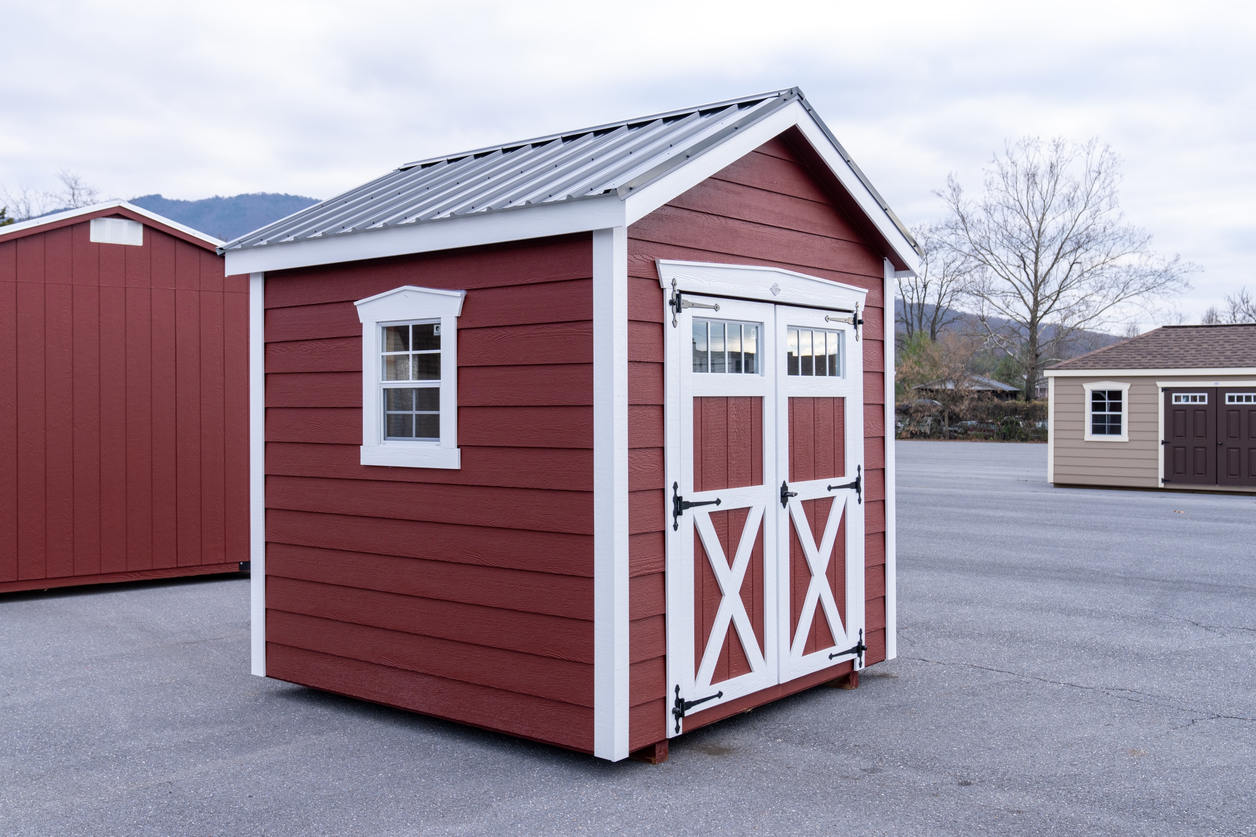 Wide photo of red garden house shed that Valley Structures gave away on social media