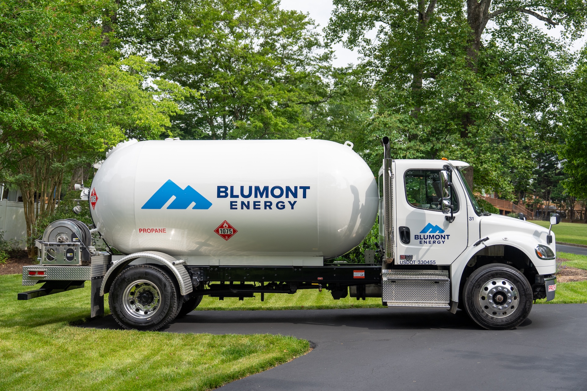 Blumont Energy propane delivery truck with branded logo wrap. Custom photography and logo design by Estland.